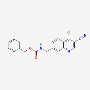 molecular formula C19H14ClN3O2 B15366755 Carbamic acid, (4-chloro-3-cyano-7-quinolinyl)methyl-, phenylmethyl ester (9CI) 