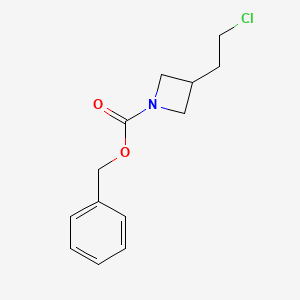 molecular formula C13H16ClNO2 B15369408 Benzyl 3-(2-chloroethyl)azetidine-1-carboxylate 