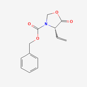 molecular formula C13H13NO4 B15428532 Benzyl (4S)-4-ethenyl-5-oxo-1,3-oxazolidine-3-carboxylate CAS No. 90292-75-4