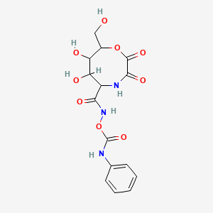 molecular formula C15H17N3O9 B15503824 [(5R,6R,7S,8R)-6,7-dihydroxy-8-(hydroxymethyl)-2,3-dioxo-1,4-oxazocan-5-yl]formamido N-phenylcarbamate 