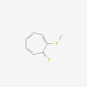 molecular formula C8H8S2 B158788 2-(Methylthio)-2,4,6-cycloheptatriene-1-thione CAS No. 128742-65-4