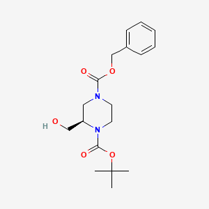 (R)-4-Benzyl 1-tert-butyl 2-(hydroxymethyl)piperazine-1,4-dicarboxylate