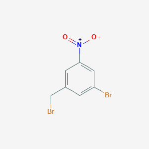 molecular formula C7H5Br2NO2 B161366 1-Bromo-3-(bromomethyl)-5-nitrobenzene CAS No. 139194-80-2