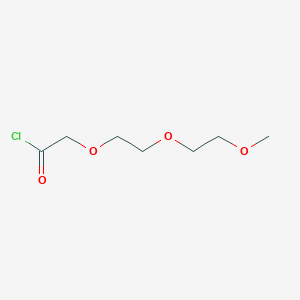 B1620495 3,6,9-Trioxadecanoyl chloride CAS No. 63881-16-3