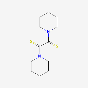 molecular formula C12H20N2S2 B1625572 Piperidine, 1,1'-(1,2-dithioxo-1,2-ethanediyl)bis- CAS No. 24528-76-5