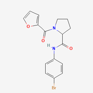 N-(4-bromophenyl)-1-(furan-2-carbonyl)pyrrolidine-2-carboxamide
