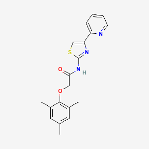 B1663365 N-(4-pyridin-2-yl-1,3-thiazol-2-yl)-2-(2,4,6-trimethylphenoxy)acetamide CAS No. 752219-52-6
