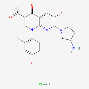 B1664242 1,8-Naphthyridine-3-carboxaldehyde, 7-(3-amino-1-pyrrolidinyl)-1-(2,4-difluorophenyl)-6-fluoro-1,4-dihydro-4-oxo-, monohydrochloride CAS No. 134762-03-1