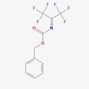 molecular formula C11H7F6NO2 B166774 Benzyl (2,2,2-trifluoro-1-trifluoromethylethylidene)carbamate CAS No. 128229-95-8