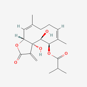molecular formula C19H26O6 B1674782 [(3aS,4S,5R,6Z,10Z,11aR)-3a,4-dihydroxy-6,10-dimethyl-3-methylidene-2-oxo-5,8,9,11a-tetrahydro-4H-cyclodeca[b]furan-5-yl] 2-methylpropanoate CAS No. 103425-50-9
