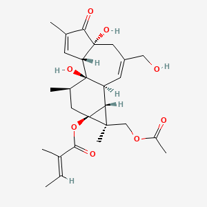 molecular formula C27H36O8 B1675283 [(1R,2S,6R,10S,11R,12S,13S,15R)-12-(Acetyloxymethyl)-1,6-dihydroxy-8-(hydroxymethyl)-4,12,15-trimethyl-5-oxo-13-tetracyclo[8.5.0.02,6.011,13]pentadeca-3,8-dienyl] (E)-2-methylbut-2-enoate CAS No. 39071-30-2