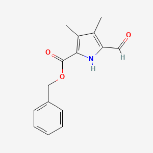 molecular formula C15H15NO3 B1679888 1H-Pyrrole-2-carboxylic acid, 5-formyl-3,4-dimethyl-, phenylmethyl ester CAS No. 59435-08-4