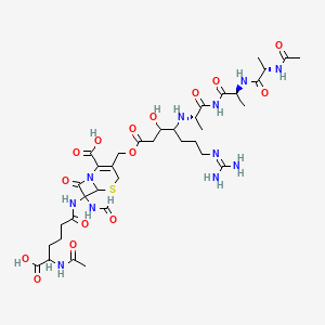 B1681085 7-[(5-acetamido-5-carboxypentanoyl)amino]-3-[[4-[[(2S)-1-[[(2S)-2-[[(2S)-2-acetamidopropanoyl]amino]propanoyl]amino]-1-oxopropan-2-yl]amino]-7-(diaminomethylideneamino)-3-hydroxyheptanoyl]oxymethyl]-7-formamido-8-oxo-5-thia-1-azabicyclo[4.2.0]oct-2-ene-2-carboxylic acid CAS No. 92121-46-5