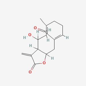 molecular formula C15H18O4 B1681560 (5E,9Z)-4-hydroxy-6-methyl-3-methylidene-2-oxo-3a,4,7,8,11,11a-hexahydrocyclodeca[b]furan-10-carbaldehyde CAS No. 73675-60-2