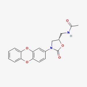 molecular formula C18H16N2O5 B1682861 (S)-N-(3-Dibenzo[1,4]dioxin-2-yl-2-oxo-oxazolidin-5-ylmethyl)-acetamide CAS No. 1021186-98-0