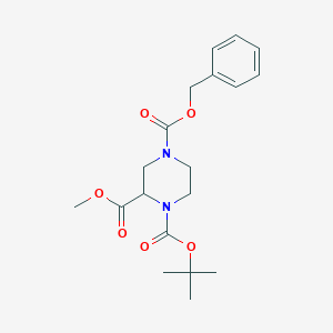 molecular formula C19H26N2O6 B169491 4-Benzyl 1-tert-butyl 2-methyl piperazine-1,2,4-tricarboxylate CAS No. 129799-14-0