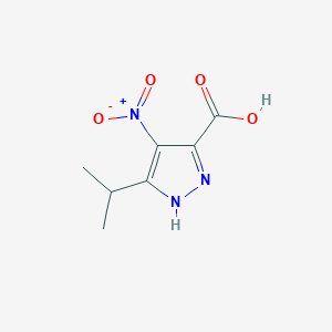 molecular formula C7H9N3O4 B169539 3-isopropyl-4-nitro-1H-pyrazole-5-carboxylic acid CAS No. 141721-97-3