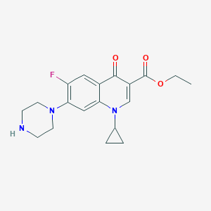 molecular formula C19H22FN3O3 B173979 Ethyl 1-cyclopropyl-6-fluoro-4-oxo-7-(piperazin-1-yl)-1,4-dihydroquinoline-3-carboxylate CAS No. 105404-65-7
