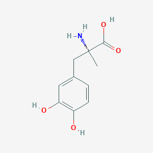 molecular formula C10H13NO4 B023093 (2R)-2-amino-3-(3,4-dihydroxyphenyl)-2-methylpropanoic acid CAS No. 2799-15-7