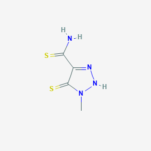 molecular formula C4H6N4S2 B023121 1-methyl-5-sulfanylidene-2H-triazole-4-carbothioamide CAS No. 100097-69-6
