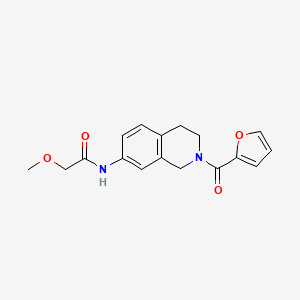 molecular formula C17H18N2O4 B2357308 N-(2-(furan-2-carbonyl)-1,2,3,4-tetrahydroisoquinolin-7-yl)-2-methoxyacetamide CAS No. 955742-71-9