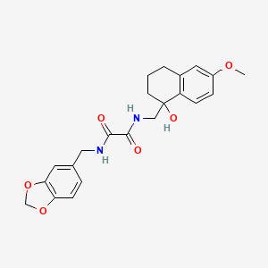 molecular formula C22H24N2O6 B2357630 N1-(benzo[d][1,3]dioxol-5-ylmethyl)-N2-((1-hydroxy-6-methoxy-1,2,3,4-tetrahydronaphthalen-1-yl)methyl)oxalamide CAS No. 2034443-39-3