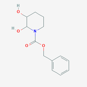 molecular formula C13H17NO4 B023696 Benzyl 2,3-dihydroxypiperidine-1-carboxylate CAS No. 473436-50-9