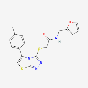 molecular formula C18H16N4O2S2 B2376466 N-[(furan-2-yl)methyl]-2-{[5-(4-methylphenyl)-[1,2,4]triazolo[3,4-b][1,3]thiazol-3-yl]sulfanyl}acetamide CAS No. 690645-24-0