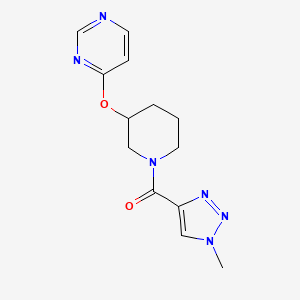 molecular formula C13H16N6O2 B2377231 (1-methyl-1H-1,2,3-triazol-4-yl)(3-(pyrimidin-4-yloxy)piperidin-1-yl)methanone CAS No. 2034523-82-3
