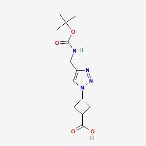 B2381739 3-[4-[[(2-Methylpropan-2-yl)oxycarbonylamino]methyl]triazol-1-yl]cyclobutane-1-carboxylic acid CAS No. 2361586-96-9