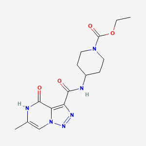 molecular formula C15H20N6O4 B2386392 Ethyl 4-{[(6-methyl-4-oxo-4,5-dihydro[1,2,3]triazolo[1,5-a]pyrazin-3-yl)carbonyl]amino}piperidine-1-carboxylate CAS No. 1396859-05-4