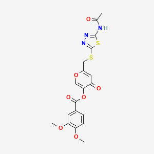 6-(((5-acetamido-1,3,4-thiadiazol-2-yl)thio)methyl)-4-oxo-4H-pyran-3-yl 3,4-dimethoxybenzoate