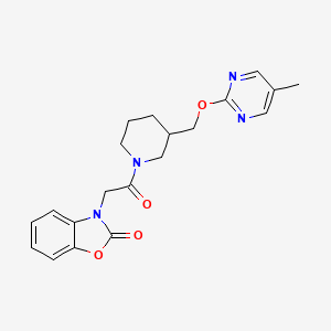 B2402615 3-[2-[3-[(5-Methylpyrimidin-2-yl)oxymethyl]piperidin-1-yl]-2-oxoethyl]-1,3-benzoxazol-2-one CAS No. 2379970-49-5