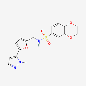 molecular formula C17H17N3O5S B2422528 N-[[5-(2-Methylpyrazol-3-yl)furan-2-yl]methyl]-2,3-dihydro-1,4-benzodioxine-6-sulfonamide CAS No. 2415500-97-7