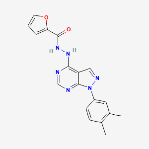 molecular formula C18H16N6O2 B2423840 N'-[1-(3,4-dimethylphenyl)-1H-pyrazolo[3,4-d]pyrimidin-4-yl]furan-2-carbohydrazide CAS No. 881082-74-2