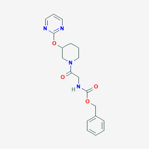 molecular formula C19H22N4O4 B2433821 Benzyl (2-oxo-2-(3-(pyrimidin-2-yloxy)piperidin-1-yl)ethyl)carbamate CAS No. 2034325-39-6