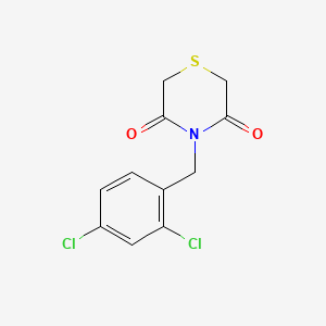 molecular formula C11H9Cl2NO2S B2444329 4-[(2,4-Dichlorophenyl)methyl]thiomorpholine-3,5-dione CAS No. 338953-59-6