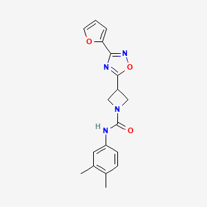 molecular formula C18H18N4O3 B2445790 N-(3,4-Dimethylphenyl)-3-[3-(furan-2-YL)-1,2,4-oxadiazol-5-YL]azetidine-1-carboxamide CAS No. 1448035-63-9