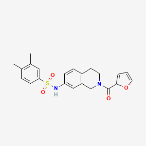 molecular formula C22H22N2O4S B2445874 N-(2-(furan-2-carbonyl)-1,2,3,4-tetrahydroisoquinolin-7-yl)-3,4-dimethylbenzenesulfonamide CAS No. 955723-12-3
