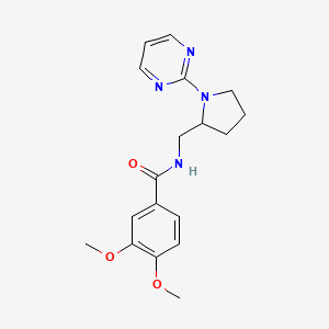 molecular formula C18H22N4O3 B2451595 3,4-dimethoxy-N-{[1-(pyrimidin-2-yl)pyrrolidin-2-yl]methyl}benzamide CAS No. 2097859-38-4