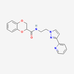 molecular formula C19H18N4O3 B2453846 N-{2-[3-(pyridin-2-yl)-1H-pyrazol-1-yl]ethyl}-2,3-dihydro-1,4-benzodioxine-2-carboxamide CAS No. 1448071-76-8
