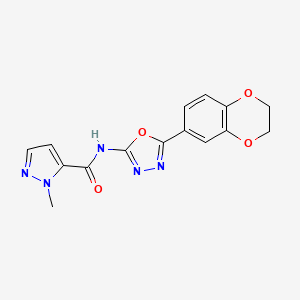 molecular formula C15H13N5O4 B2458055 N-(5-(2,3-dihydrobenzo[b][1,4]dioxin-6-yl)-1,3,4-oxadiazol-2-yl)-1-methyl-1H-pyrazole-5-carboxamide CAS No. 1171632-03-3