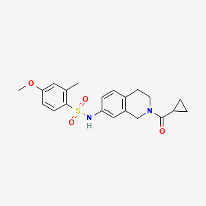 molecular formula C21H24N2O4S B2458634 N-(2-(cyclopropanecarbonyl)-1,2,3,4-tetrahydroisoquinolin-7-yl)-4-methoxy-2-methylbenzenesulfonamide CAS No. 955776-90-6
