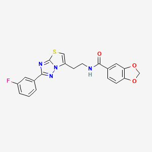 molecular formula C20H15FN4O3S B2471143 N-{2-[2-(3-fluorophenyl)-[1,2,4]triazolo[3,2-b][1,3]thiazol-6-yl]ethyl}-2H-1,3-benzodioxole-5-carboxamide CAS No. 946205-40-9