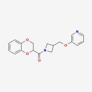B2474364 2,3-Dihydro-1,4-benzodioxin-3-yl-[3-(pyridin-3-yloxymethyl)azetidin-1-yl]methanone CAS No. 2379972-48-0