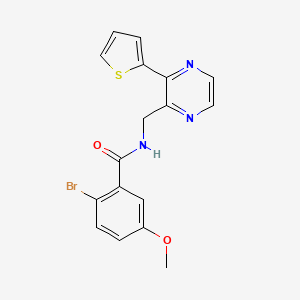 2-bromo-5-methoxy-N-((3-(thiophen-2-yl)pyrazin-2-yl)methyl)benzamide