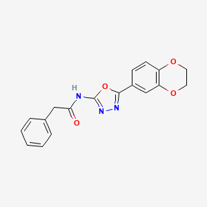 molecular formula C18H15N3O4 B2477848 N-[5-(2,3-dihydro-1,4-benzodioxin-6-yl)-1,3,4-oxadiazol-2-yl]-2-phenylacetamide CAS No. 851094-69-4