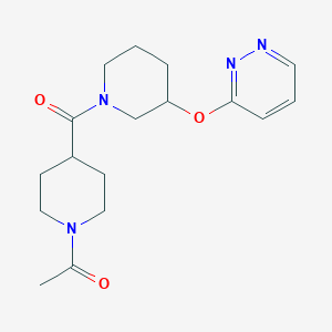 1-(4-(3-(Pyridazin-3-yloxy)piperidine-1-carbonyl)piperidin-1-yl)ethanone