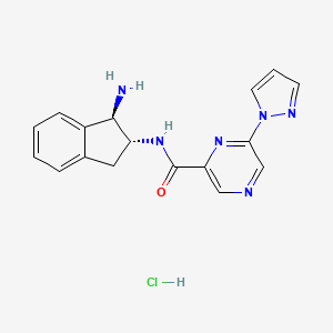 B2487336 N-[(1R,2R)-1-Amino-2,3-dihydro-1H-inden-2-yl]-6-pyrazol-1-ylpyrazine-2-carboxamide;hydrochloride CAS No. 2418595-47-6