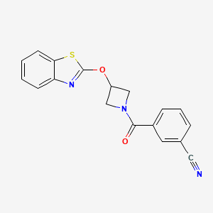 molecular formula C18H13N3O2S B2491271 3-[3-(1,3-BENZOTHIAZOL-2-YLOXY)AZETIDINE-1-CARBONYL]BENZONITRILE CAS No. 1421480-93-4